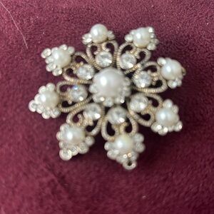 Silver brooch with rhinestones and pearls